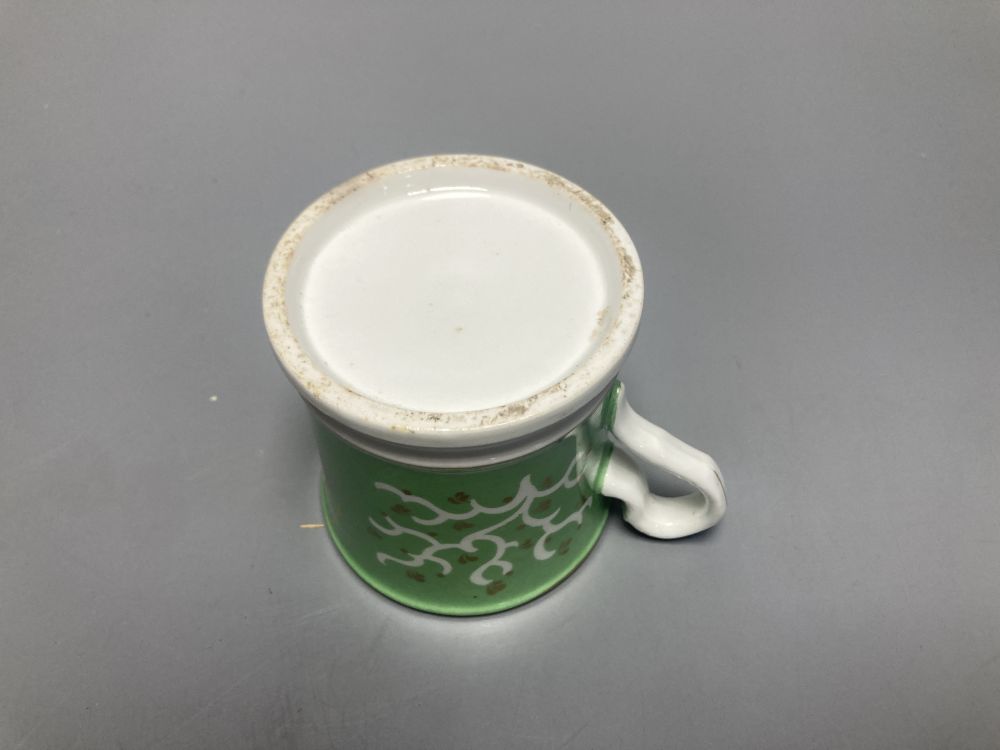 Two Meissen onion pattern shell-shaped dishes, width 19cm, and an English porcelain cabinet cup, inscribed in gilt, Think on me